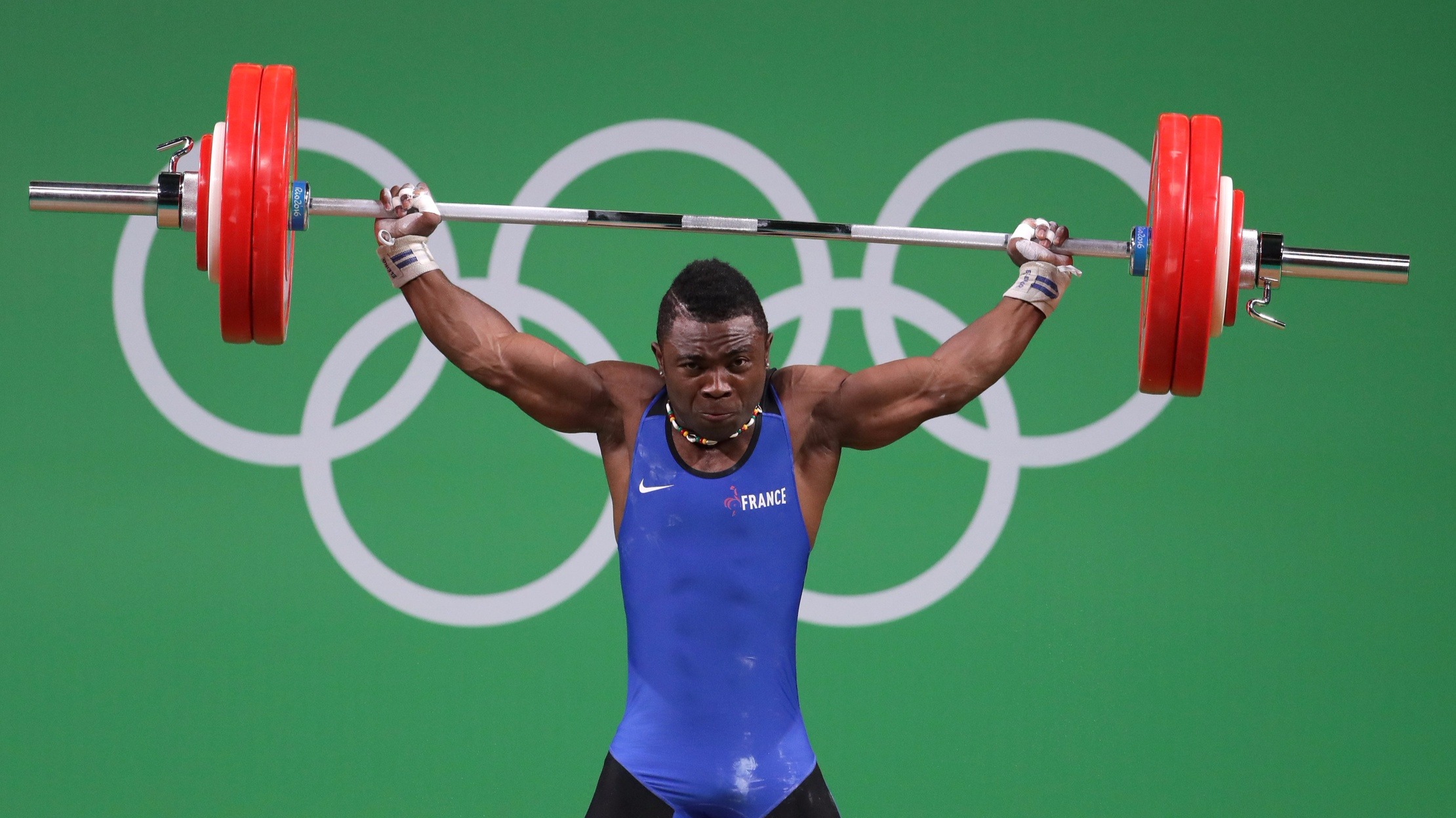 Bernardin Ledoux Kingue Matam (FRA) competes in the men's 69kg Group A weightlifting event at Riocentro - Pavilion 2 during the Rio 2016 Summer Olympic Games.
