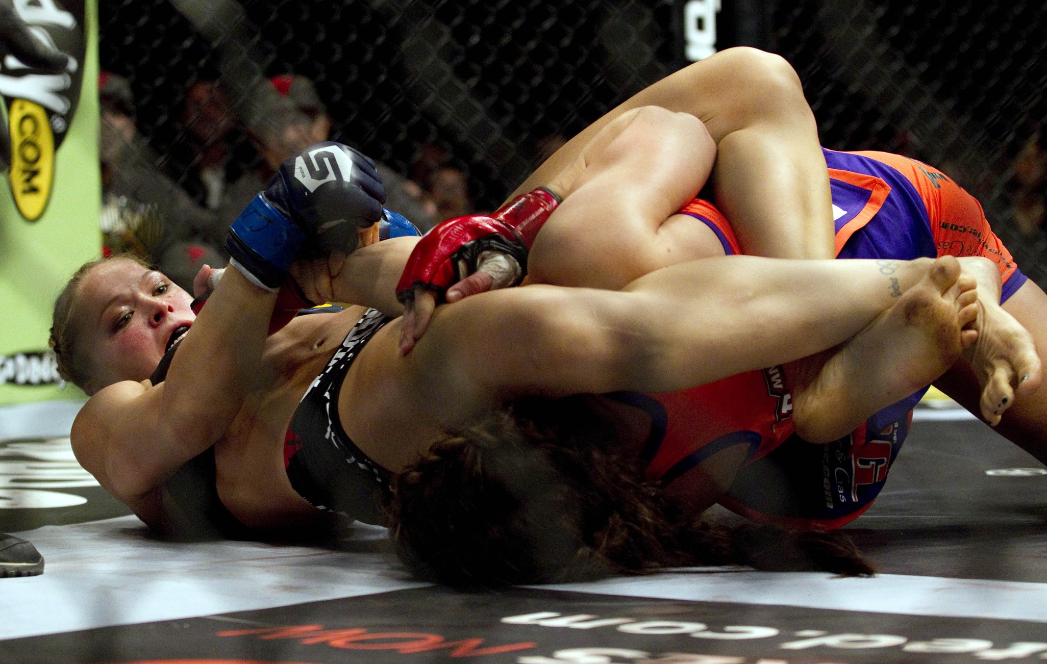 March 3, 2012; Columbus, OH, USA; Ronda Rousey gets Miesha Tate in an armba...